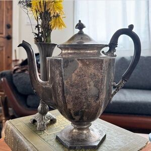 Antique teapot watering can.